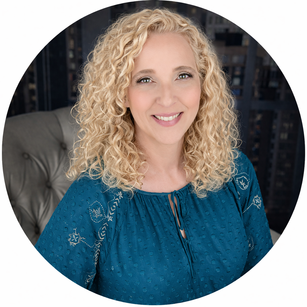 Tina Garrett smiling in a teal blouse